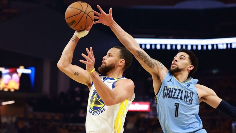 Butler, Curry lead Warriors past Grizzlies, into playoffs
